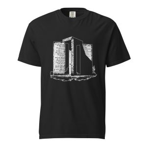 Black T-shirt displaying a Georgia Guidestones monument design inspired by the historic granite structure